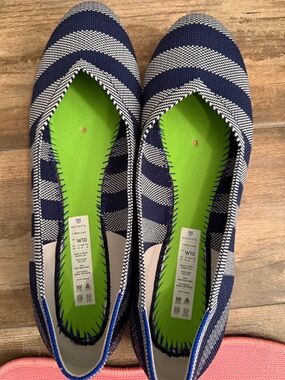 Rothy’s ballet flat. Size 10. Navy stripe with pink soles / accents.